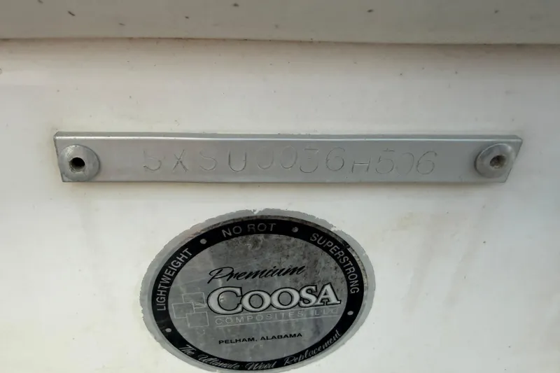 Slide: The Image of 2006 Seahunt 207 Triton boat with Coosa Composites label and serial number plate. - 9