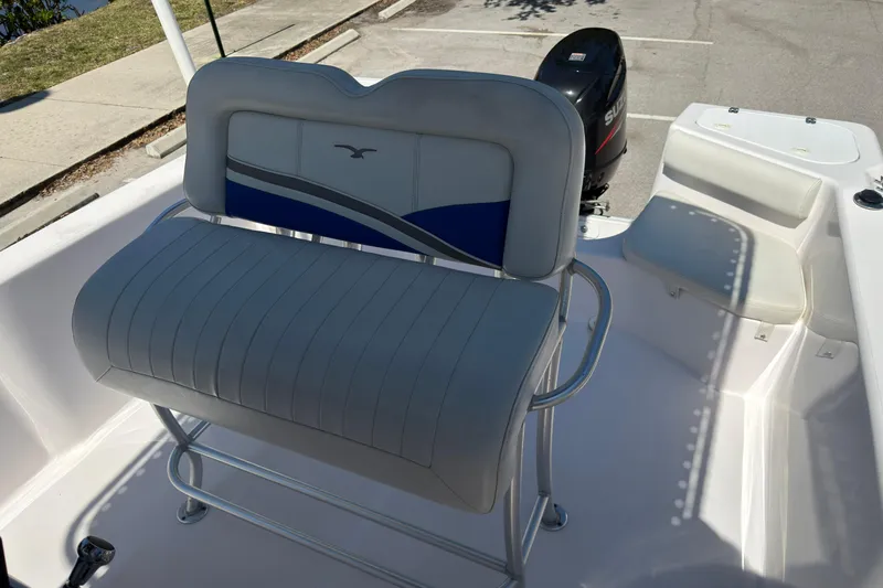 Slide: The Image of 2016 Pro-Line 20 Sport boat interior with seating and outboard motor. - 15