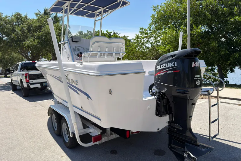 Slide: The Image of 2016 Pro-Line 20 Sport boat with Suzuki 140 outboard motor on trailer. - 5