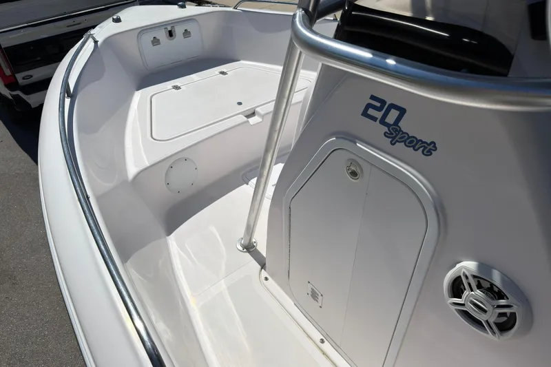 Slide: The Image of 2016 Pro-Line 20 Sport boat interior with storage compartments and speaker. - 17