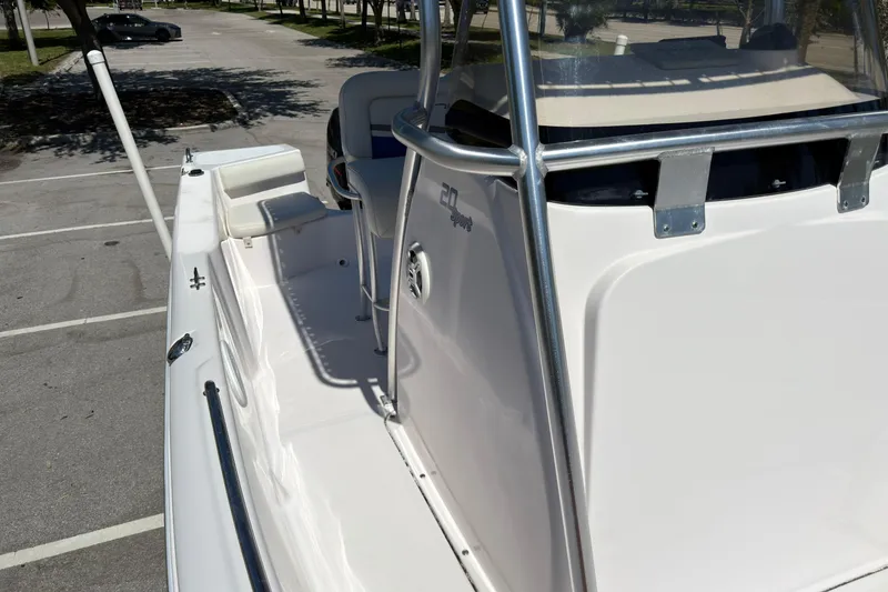 Slide: The Image of 2016 Pro-Line 20 Sport boat, white exterior, parked in a sunny lot. - 22