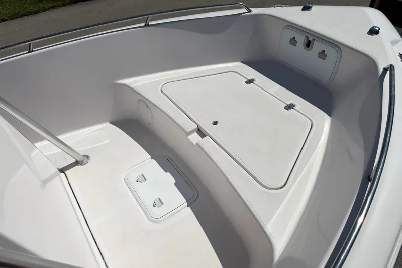 Slide: The Image of 2016 Pro-Line 20 Sport boat interior with storage compartments and sleek design. - 20