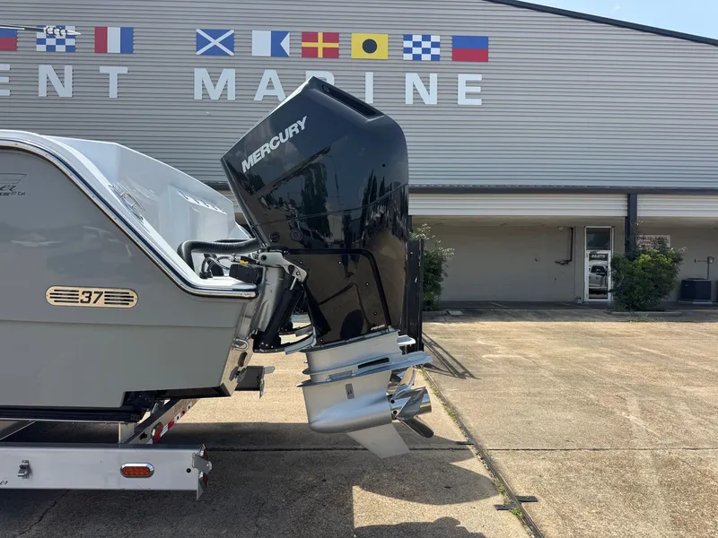 Slide: The Image of A Mercury outboard motor is mounted on a 2027 Front Runner Boatworks 37 Cat. - 4