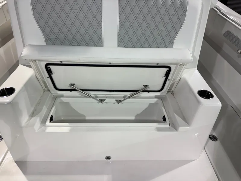 Slide: The Image of The 2027 Front Runner Boatworks 37 Cat features a cushioned bench seat with storage underneath. - 16
