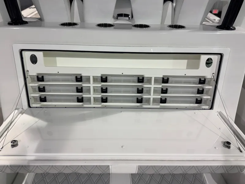 Slide: The Image of The image shows a modern fishing rod holder and storage system on a boat. - 23