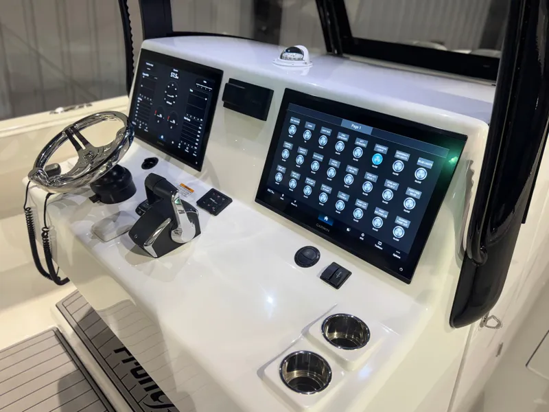 Slide: The Image of The image shows the cockpit of a 2027 Front Runner Boatworks 37 Cat with modern instruments. - 34