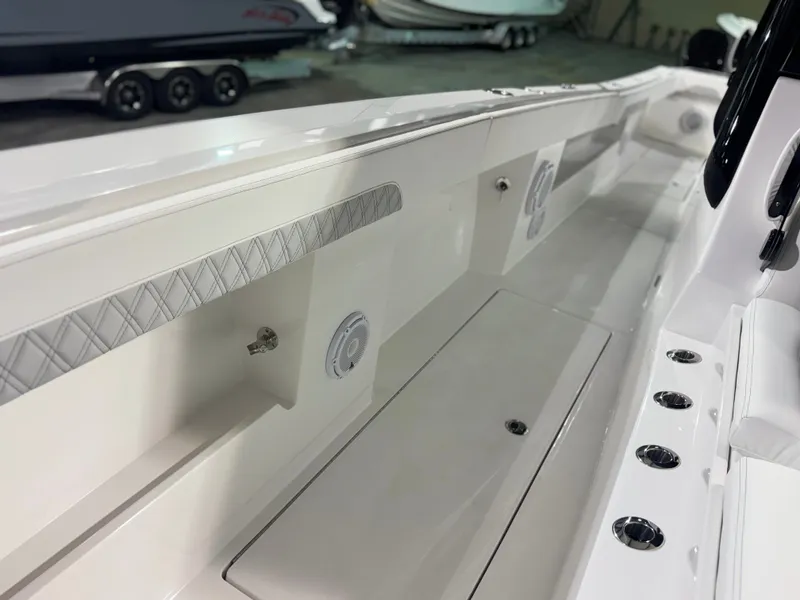 Slide: The Image of The image shows the deck of a 2027 Front Runner Boatworks 37 Cat with sleek details. - 31