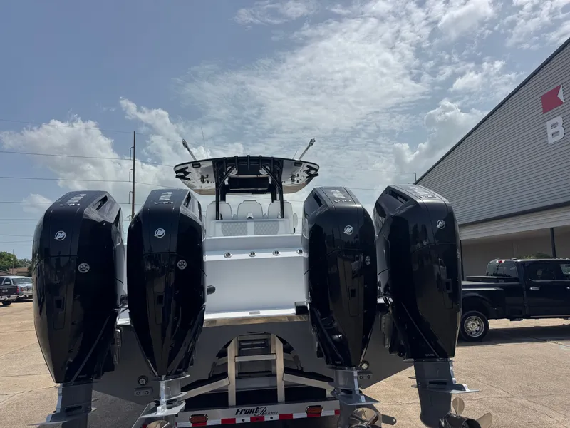 Slide: The Image of A 2027 Front Runner Boatworks 37 Cat with four powerful outboard engines on a trailer. - 3