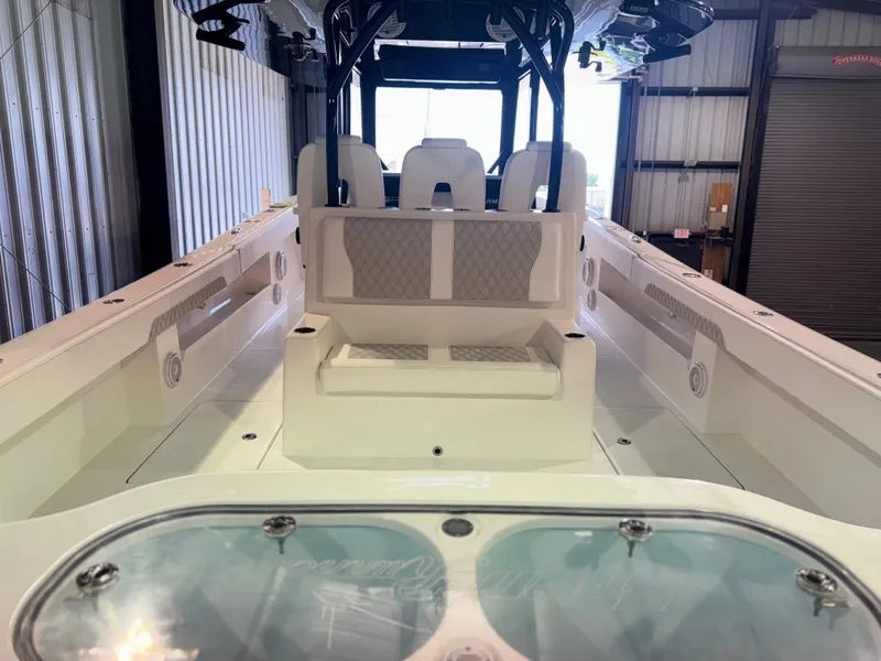 Slide: The Image of The image shows the cockpit of a 2027 Front Runner Boatworks 37 Cat with white seating. - 7