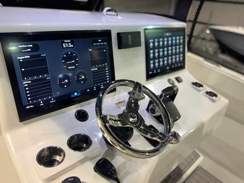 Slide: The Image of The image shows the helm of a 2027 Front Runner Boatworks 37 Cat with modern instruments. - 35