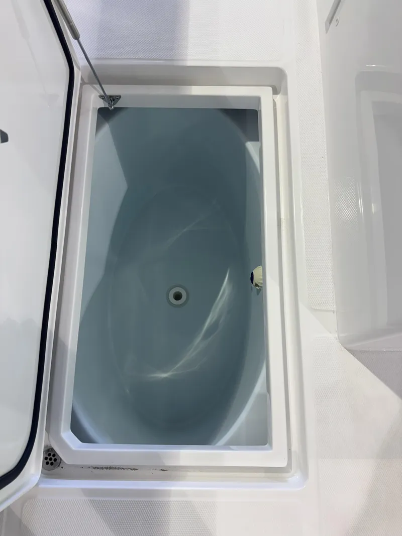 Slide: The Image of An open storage compartment on a boat with a blue interior. - 10