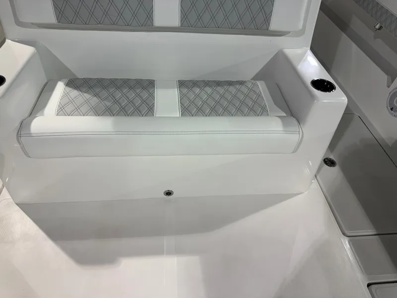 Slide: The Image of The interior of the 2027 Front Runner Boatworks 37 Cat features a cushioned bench with diamond pattern. - 15