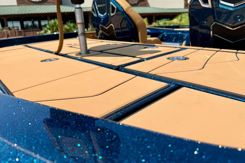 Slide: The Image of 2026 Ranger Z520R Ultra boat deck with sparkling blue finish and tan accents. - 13