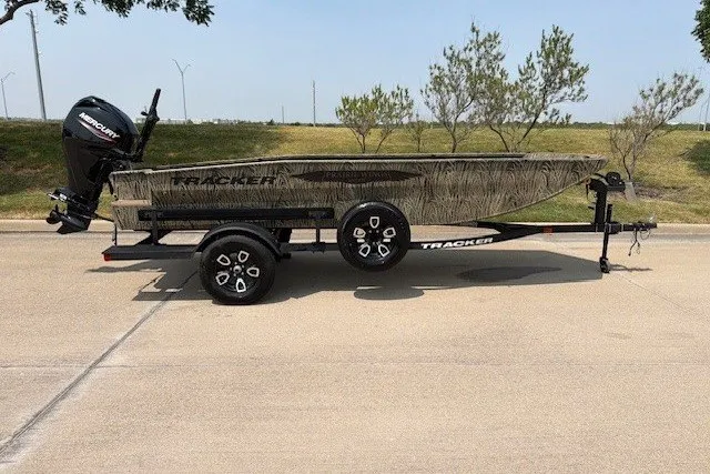 The Image of 2026 Tracker Grizzly 1650 T Prairie Wings Edition boat on trailer, side view. - 1