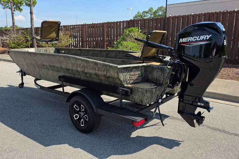 Slide: The Image of 2026 Tracker Grizzly 1650 T Prairie Wings Edition boat with Mercury engine on trailer. - 8
