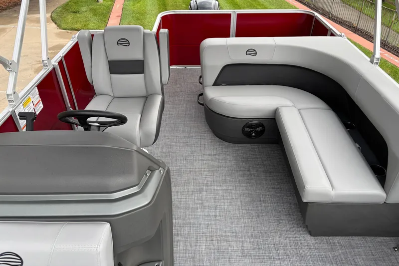 Slide: The Image of 2026 Sun Tracker Party Barge 18 DLX interior with gray seating and red accents. - 5