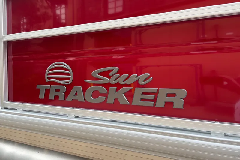Slide: The Image of 2026 Sun Tracker Party Barge 18 DLX logo on red background. - 8