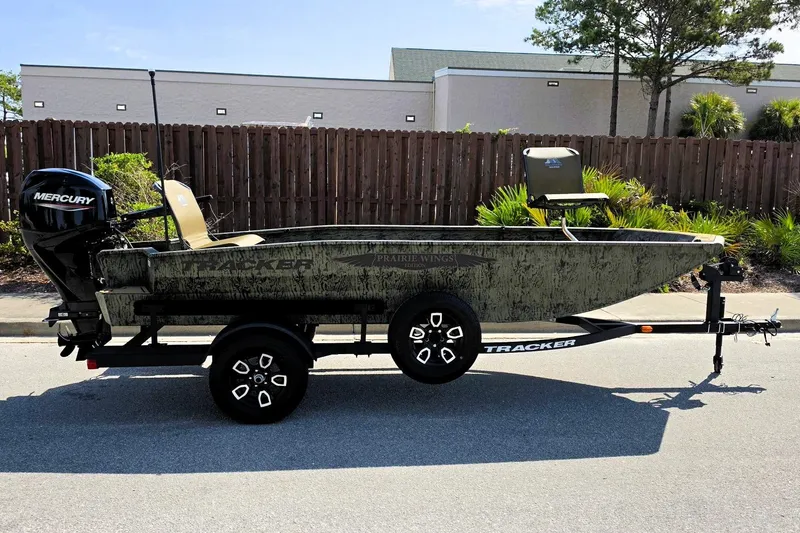 The Image of 2026 Tracker Grizzly 1650 T Prairie Wings Edition boat on trailer, side view. - 0