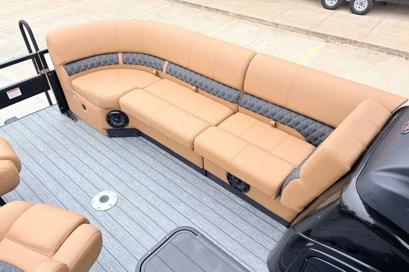 Slide: The Image of Luxurious seating on 2026 Ranger 223FC boat, featuring tan and gray upholstery. - 16