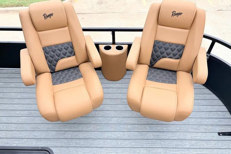 Slide: The Image of Luxurious tan and gray seats on 2026 Ranger 223FC boat deck. - 15