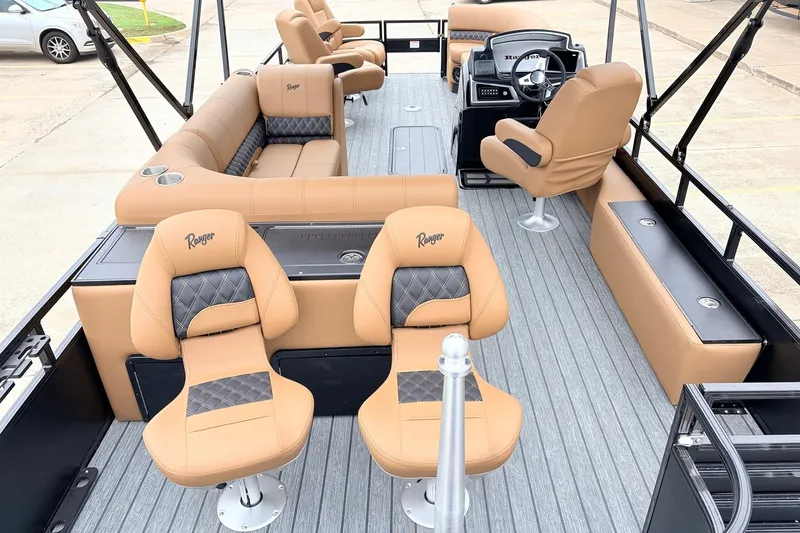 Slide: The Image of Luxurious interior of 2026 Ranger 223FC boat with tan seating and modern design. - 10