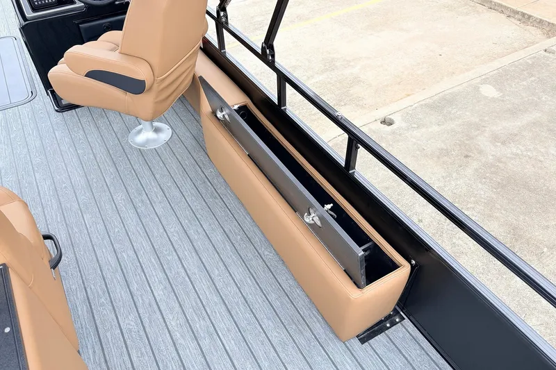 Slide: The Image of Interior of 2026 Ranger 223FC boat with tan seating and storage compartment. - 35
