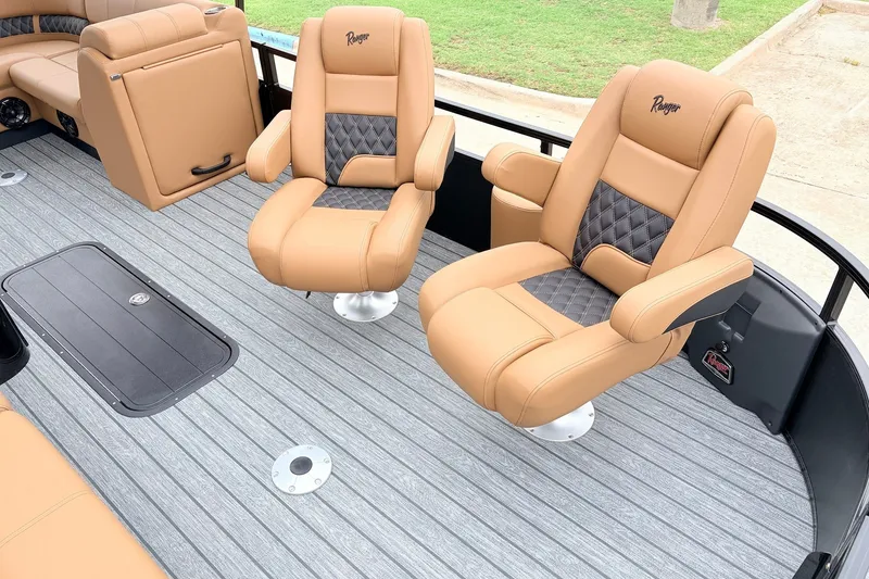 Slide: The Image of Luxurious seating on 2026 Ranger 223FC boat with tan and black upholstery. - 14
