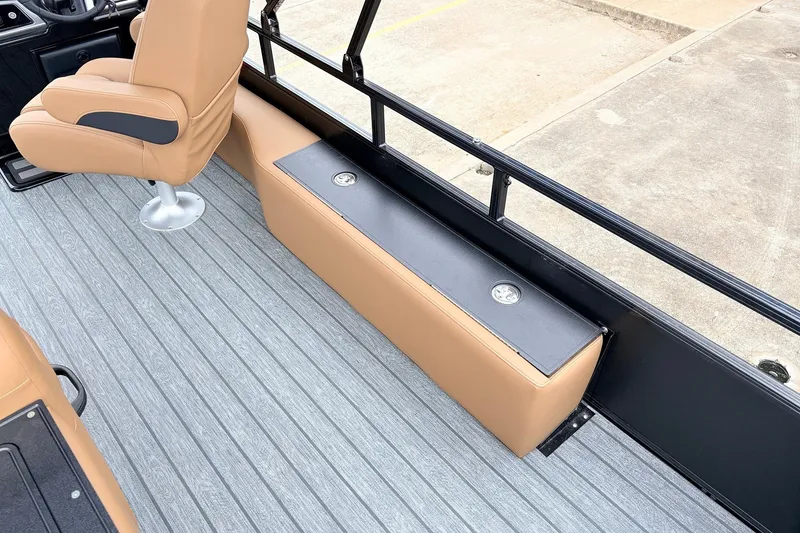 Slide: The Image of Interior of 2026 Ranger 223FC boat with tan seating and sleek flooring. - 34