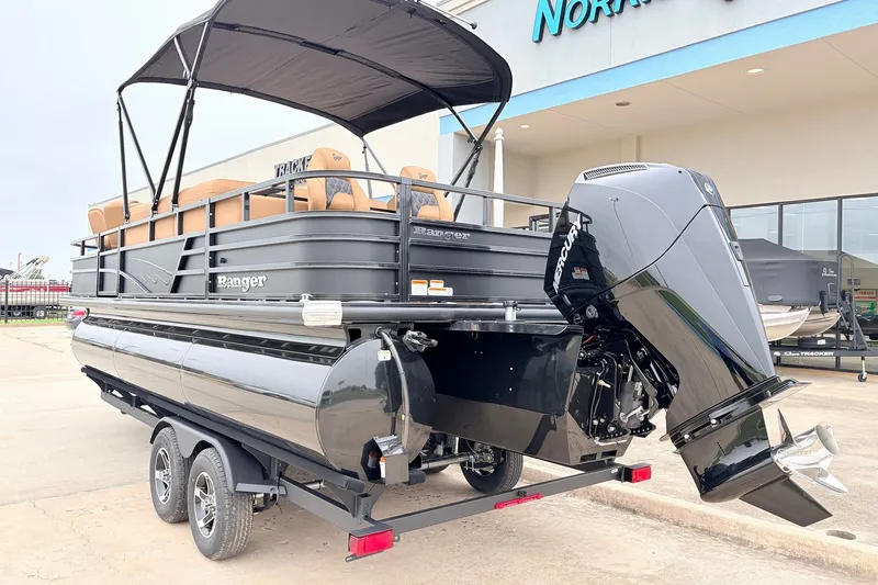 Slide: The Image of 2026 Ranger 223FC pontoon boat with Mercury outboard motor on a trailer. - 8