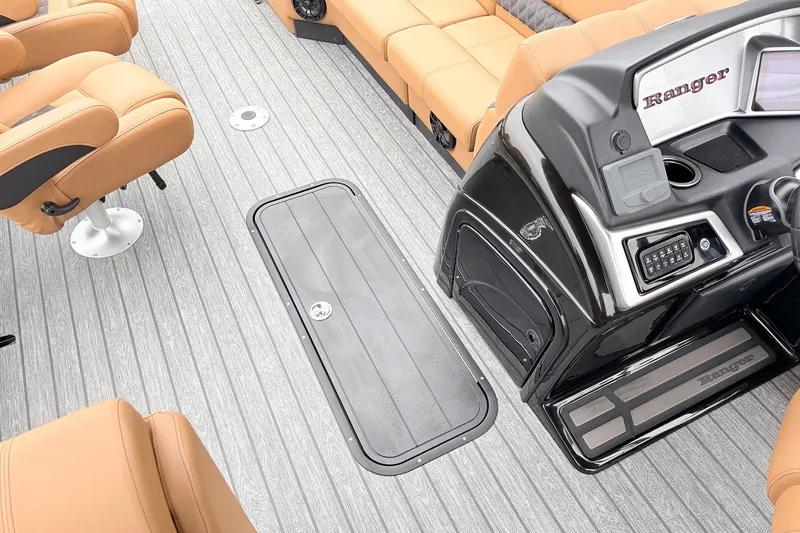 Slide: The Image of Luxurious interior of 2026 Ranger 223FC boat with tan seating and sleek control panel. - 21