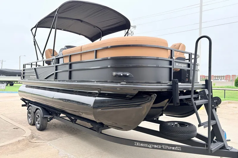 Slide: The Image of 2026 Ranger 223FC pontoon boat on trailer, featuring sleek design and spacious seating. - 4