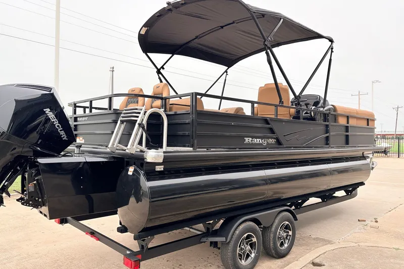 Slide: The Image of 2026 Ranger 223FC pontoon boat with Mercury engine, black exterior, and tan seating. - 6
