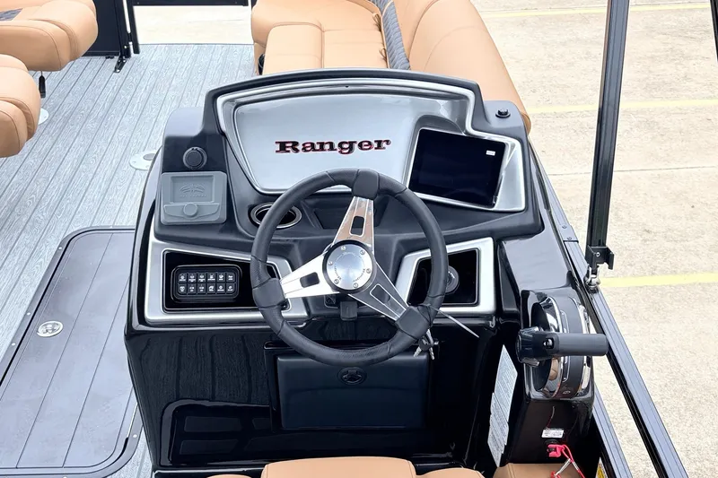 Slide: The Image of 2026 Ranger 223FC boat dashboard with steering wheel and control panel. - 30