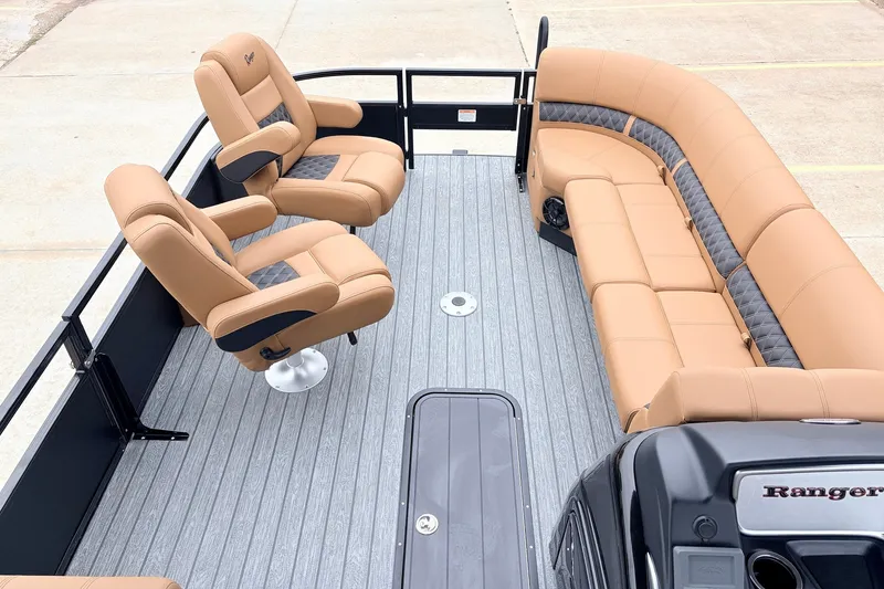 Slide: The Image of 2026 Ranger 223FC boat interior with tan seating and modern design. - 12