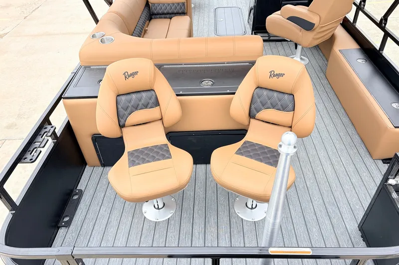 Slide: The Image of 2026 Ranger 223FC boat interior with tan and gray seating, featuring stylish design and comfort. - 38