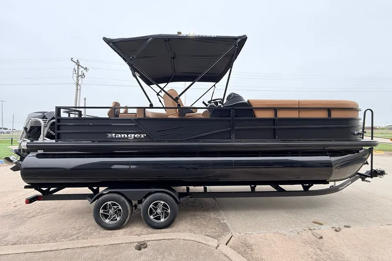 Slide: The Image of 2026 Ranger 223FC pontoon boat with black exterior and tan seating on a trailer. - 5
