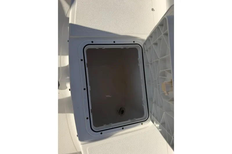Slide: The Image of Open storage compartment on a 2011 Sea Fox 216 Dual Console boat. - 22