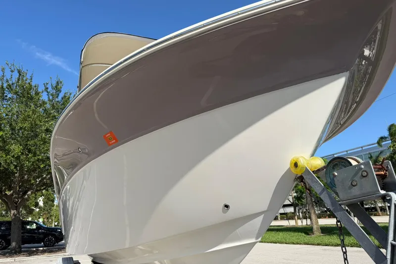 Slide: The Image of 2011 Sea Fox 216 Dual Console boat on trailer under clear blue sky. - 9