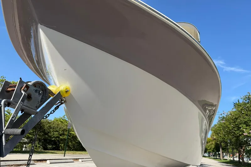 Slide: The Image of 2011 Sea Fox 216 Dual Console boat on trailer, viewed from below against blue sky. - 8