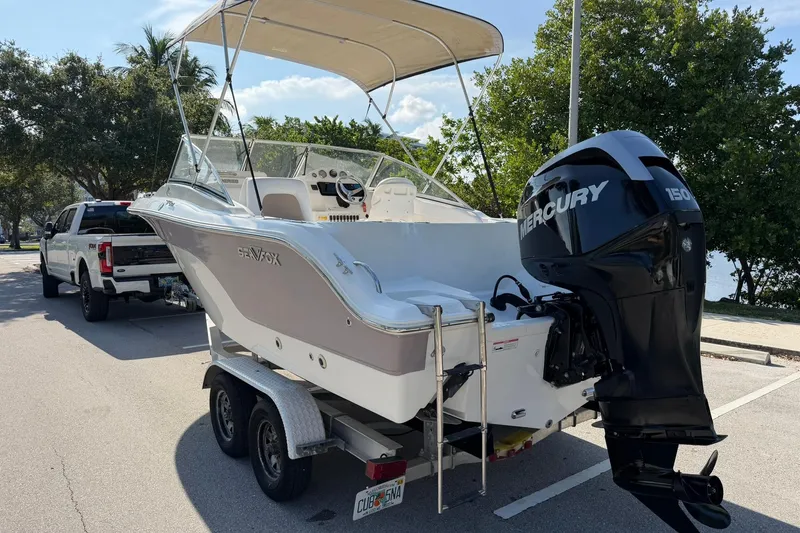 Slide: The Image of 2011 Sea Fox 216 Dual Console boat on trailer with Mercury 150 engine. - 5
