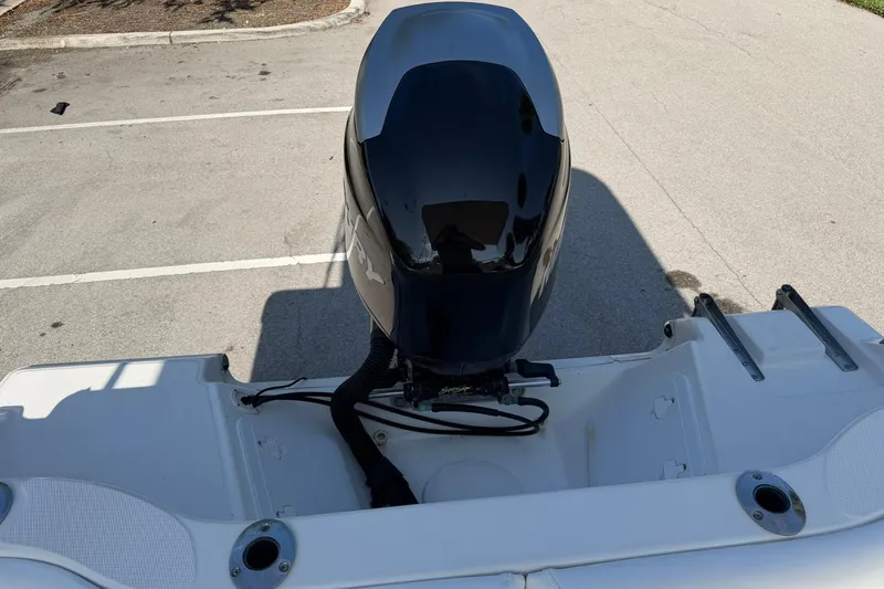 Slide: The Image of 2011 Sea Fox 216 Dual Console boat with outboard motor in a parking lot. - 23