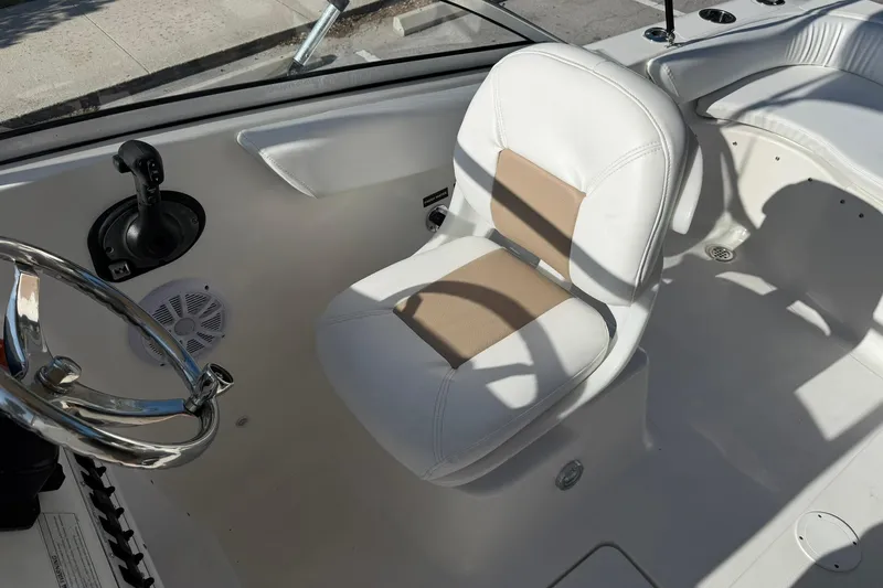 Slide: The Image of Interior of 2011 Sea Fox 216 Dual Console boat with steering wheel and seating. - 14