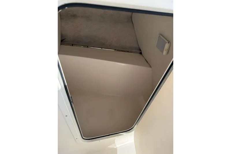 Slide: The Image of Storage compartment inside a 2011 Sea Fox 216 Dual Console boat. - 21