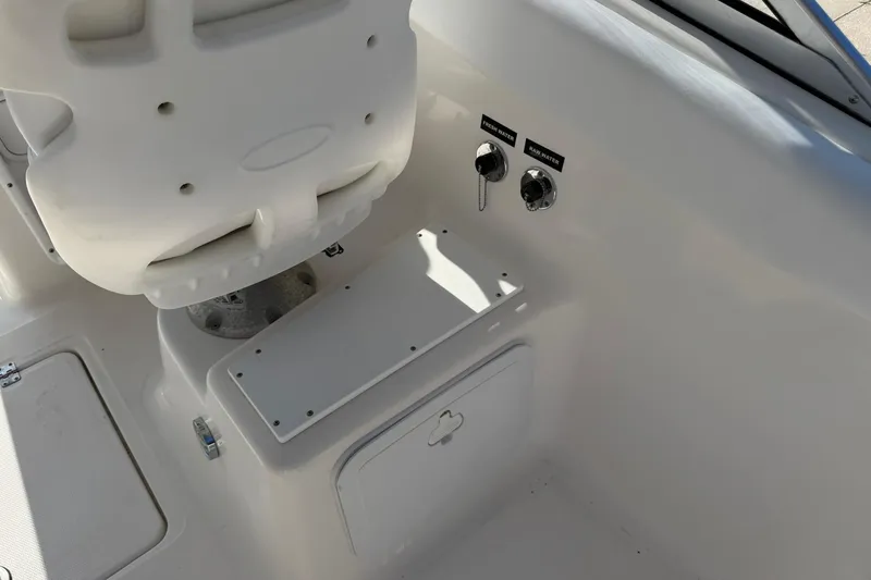 Slide: The Image of 2011 Sea Fox 216 Dual Console boat interior with seat and water controls. - 24