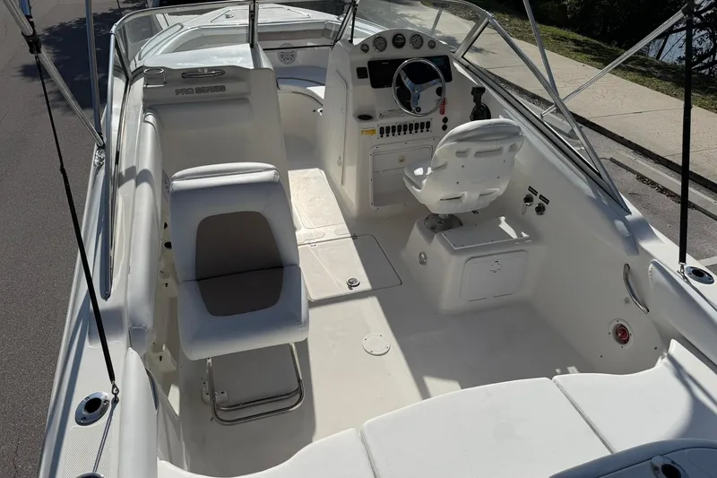 Slide: The Image of 2011 Sea Fox 216 Dual Console boat interior with seating and steering console. - 10