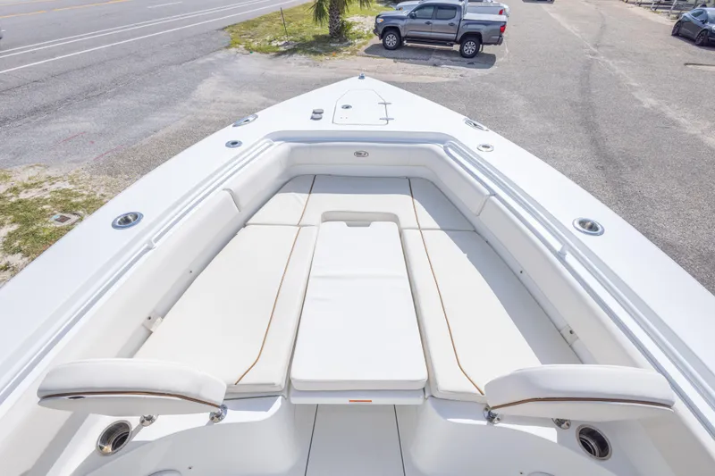 Slide: The Image of 2022 Sea Hunt Gamefish 27 boat with spacious white seating area. - 27