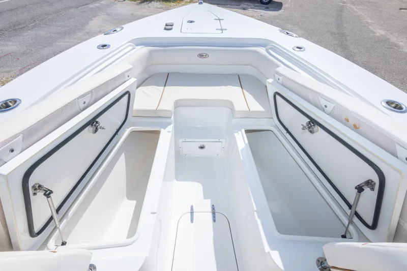 Slide: The Image of 2022 Sea Hunt Gamefish 27 boat interior with open storage compartments. - 30