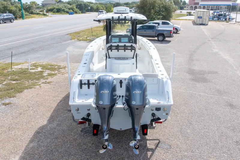 Slide: The Image of 2022 Sea Hunt Gamefish 27 boat with dual Yamaha 200 engines, parked on a lot. - 7