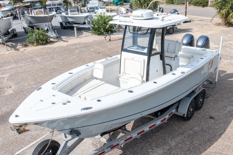 Slide: The Image of 2022 Sea Hunt Gamefish 27 boat on trailer, parked outdoors. - 10
