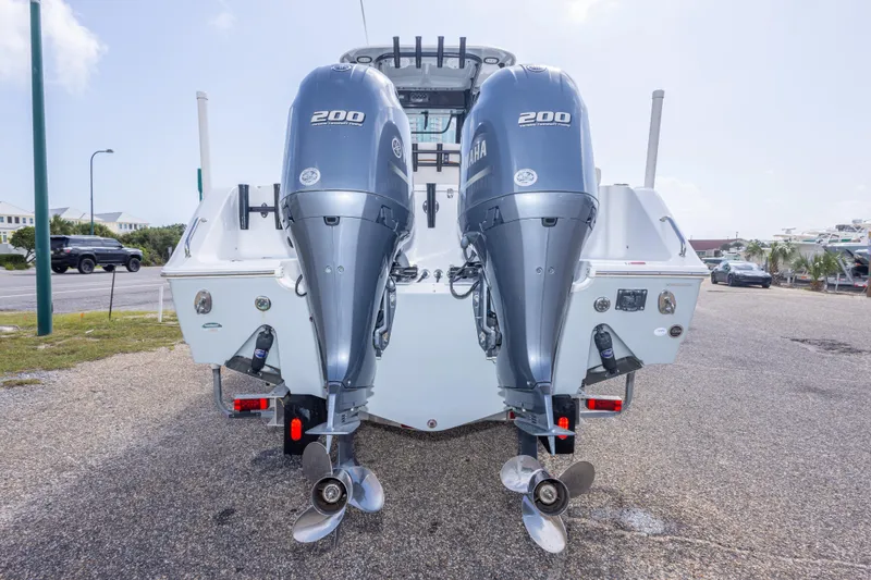 Slide: The Image of 2022 Sea Hunt Gamefish 27 with dual Yamaha 200 engines, parked on a sunny day. - 54